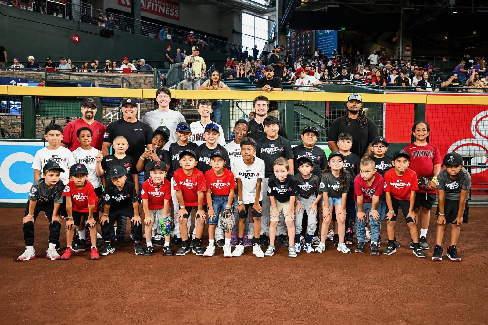 Home2First players and coaches at Chase Field, 2026